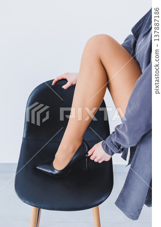 New collection of women's leather shoes, close-up of female legs in black high-heeled shoes. Shoes for spring and summer New collection of women's leather shoes, close-up of female legs in black high-heeled shoes. Shoes for spring and summer 137887186