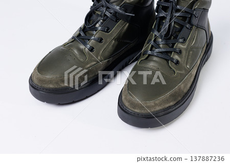 Leather short men's boots on a white background. Winter boots collection 2022. Leather short men's boots on a white background. Winter boots collection 2022. 137887236