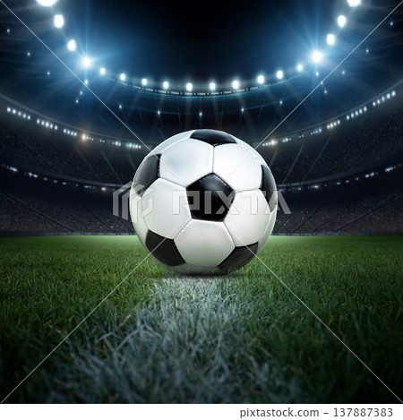 Soccer ball in the stadium at night, close-up view.  137887383