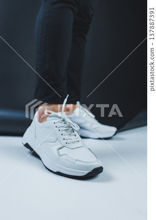 Men's casual white shoes made of genuine leather, men on shoes in white sneakers. High quality photo Men's casual white shoes made of genuine leather, men on shoes in white sneakers. High quality photo 137887391