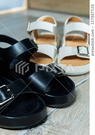 Women's leather sandals stand on the floor. Women's summer shoes. 137887528