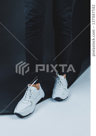 Men's casual white shoes made of genuine leather, men on shoes in white sneakers. High quality photo Men's casual white shoes made of genuine leather, men on shoes in white sneakers. High quality photo 137887582
