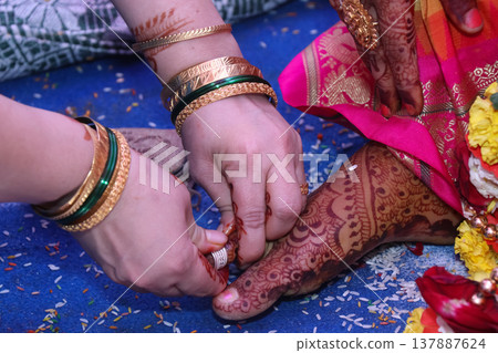 The ceremony of putting on the toe ring, ritual in Hindu weddings The ceremony of putting on the toe ring, ritual in Hindu weddings 137887624