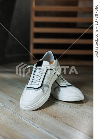 Men's white leather sneakers for every day. Collection of summer men's shoes. Stylish men's shoes for the summer Men's white leather sneakers for every day. Collection of summer men's shoes. Stylish men's shoes for the summer 137887666
