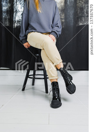 Fashionable women's stylish leather boots. Black women's boots made of genuine leather. New collection of winter shoes for stylish girls. Fashionable women's stylish leather boots. Black women's boots made of genuine leather. New collection of winter shoes for stylish girls. 137887670