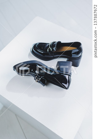 Women's leather shoes with a massive heel. Black autumn shoes for women on a white background. Women's leather shoes with a massive heel. Black autumn shoes for women on a white background. 137887672