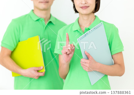 Care worker holding up index finger Care worker holding up index finger 137888361
