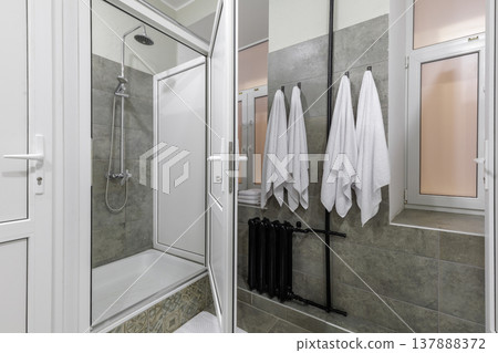 Modern Shared Hostel Shower Stall with White Towels 137888372