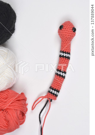 Crocheted Amigurumi Snake with Yarn Balls Crocheted Amigurumi Snake with Yarn Balls 137889044