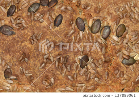 Close up of Whole Grain Bread Crust with Seeds Close up of Whole Grain Bread Crust with Seeds 137889061