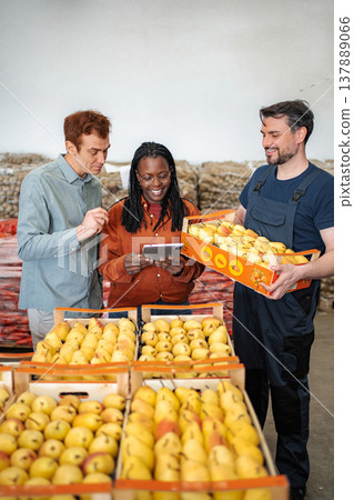 Evaluating pear quality with digital tablet in fruit warehouse 137889066