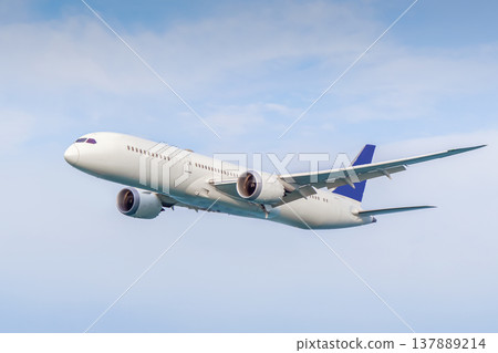 A white plane flying against the background of a blue sky without inscriptions and logos. It is a symbol of travel, sales of air tours and tickets, long-haul flights, and the development of tourism A white plane flying against the background of a blue sky without inscriptions and logos. It is a symbol of travel, sales of air tours and tickets, long-haul flights, and the development of tourism 137889214