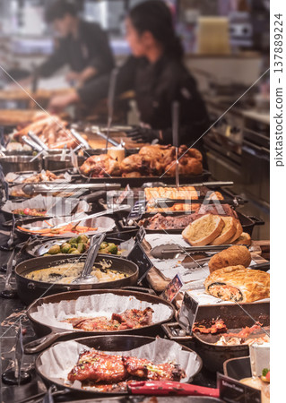 A rich selection of dishes at the Luxury Buffet restaurant located in the shopping center This is not a food court in the usual sense, but a premium buffet restaurant. In the foreground of the photo 137889224