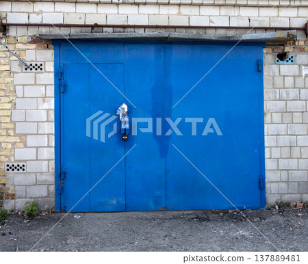 old metal door to the car garage 137889481