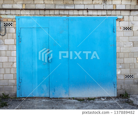old metal door to the car garage 137889482