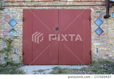old metal door to the car garage 137889487