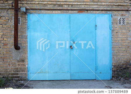old metal door to the car garage 137889489