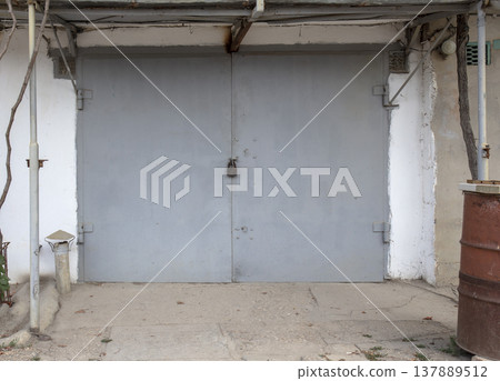 old metal door to the car garage 137889512