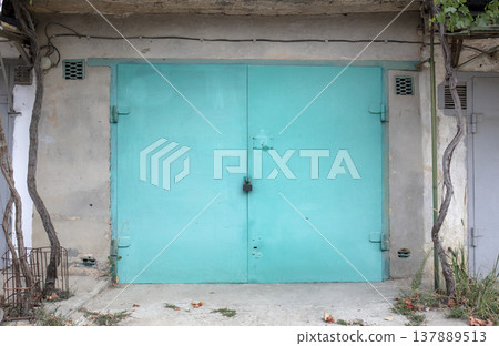 old metal door to the car garage 137889513