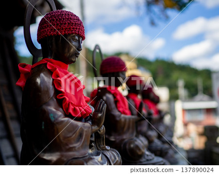 Six Jizo statues lined up in the bell tower of Kitamuki Kannon-do Temple 137890024