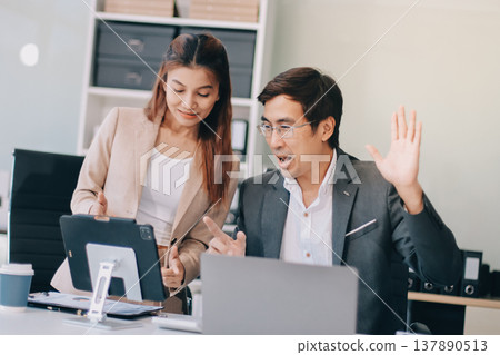 Group of business people and software developers working as a team in office Group of business people and software developers working as a team in office 137890513