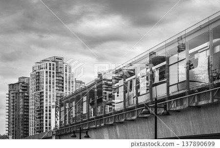 Skytrain station Metrotown, Vancouver City BC Canada. Modern downtown. Black and white photo Skytrain station Metrotown, Vancouver City BC Canada. Modern downtown. Black and white photo 137890699