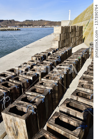 A photograph of octopus boxes drying at Otobe Fishing Port in Yakumo Town, Hokkaido, in spring. 137890764