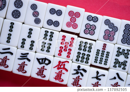 Mahjong tiles on a red background 137892505