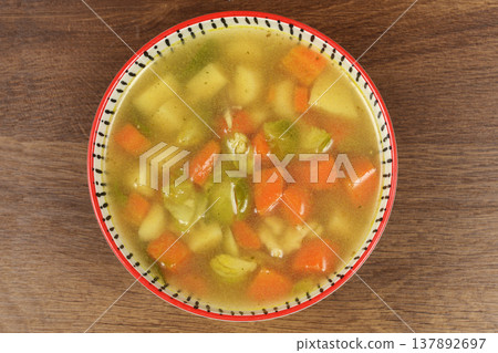 Chicken Soup with Carrots and Parsnip in a Bowl 137892697