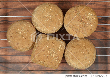 Baked Whole Wheat Bread Rolls on Cooling Rack Baked Whole Wheat Bread Rolls on Cooling Rack 137892704
