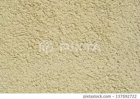 Light Yellow Textured Stucco Wall Background Light Yellow Textured Stucco Wall Background 137892722