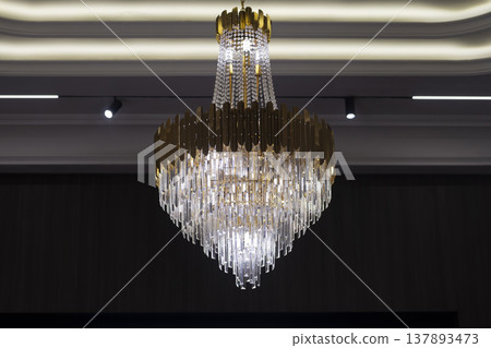 Elegant Crystal Chandelier Lighting in Luxury Interior. 137893473