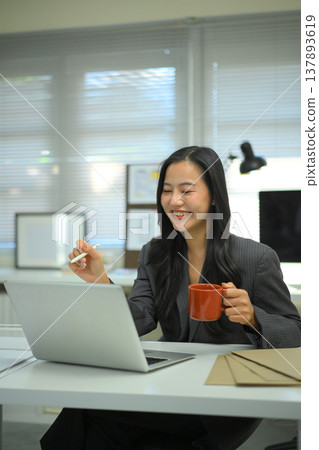 Female UX UI designer working at desk, creating interface layout and color system on desktop computer in a modern creative office Female UX UI designer working at desk, creating interface layout and color system on desktop computer in a modern creative office 137893619
