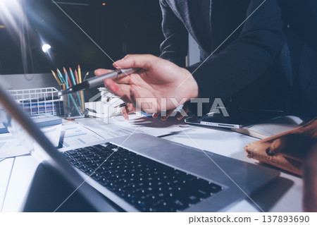 Professional photo of a person's hands reviewing a contract or legal document on a desk, for concepts of business, finance, and legal affairs Professional photo of a person's hands reviewing a contract or legal document on a desk, for concepts of business, finance, and legal affairs 137893690