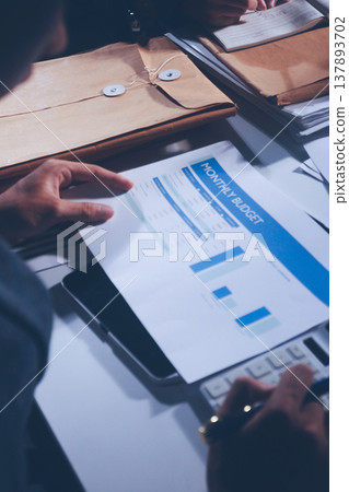Professional photo of a person's hands reviewing a contract or legal document on a desk, for concepts of business, finance, and legal affairs Professional photo of a person's hands reviewing a contract or legal document on a desk, for concepts of business, finance, and legal affairs 137893702