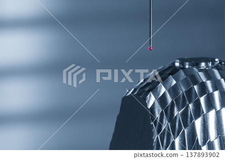 Close-up of a high-precision CMM probe measuring automotive components for quality control and dimensional inspection. Close-up of a high-precision CMM probe measuring automotive components for quality control and dimensional inspection. 137893902