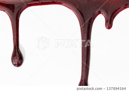 A blood spatter. A blood flowing down. Bloody pattern. Concepts of blood can be used in design. An image of dark crimson blood oozing and dripping down a stark white background. A blood spatter. A blood flowing down. Bloody pattern. Concepts of blood can be used in design. An image of dark crimson blood oozing and dripping down a stark white background. 137894164