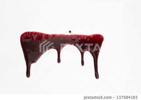 A blood spatter. A blood flowing down. Bloody pattern. Concepts of blood can be used in design. An image of dark crimson blood oozing and dripping down a stark white background. A blood spatter. A blood flowing down. Bloody pattern. Concepts of blood can be used in design. An image of dark crimson blood oozing and dripping down a stark white background. 137894165