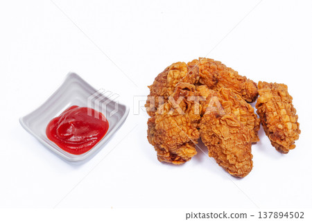 Crispy Fried Chicken Pieces With Ketchup Dip, Thick Crunchy Crust Golden Finish, Rustic Comfort Meal Crispy Fried Chicken Pieces With Ketchup Dip, Thick Crunchy Crust Golden Finish, Rustic Comfort Meal 137894502
