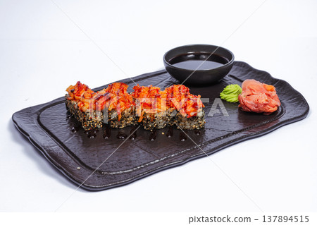 Spicy Volcano Roll Black Platter Featuring Crunchy Tempura Bits, Chili Mayo Drizzle, Nori Wrap, Soy 137894515