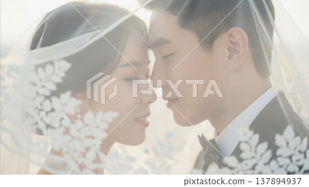 Wedding - Korean Couple Sharing Intimate Moment Under Lace Veil with Soft Backlight and Floral Detail 137894937