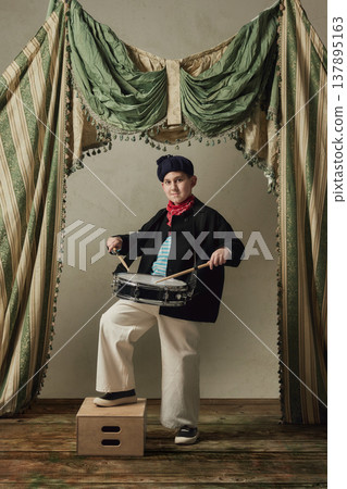 Teen boy playing snare drum on stage studio performance rhythm music portrait. Teen boy playing snare drum on stage studio performance rhythm music portrait. 137895163