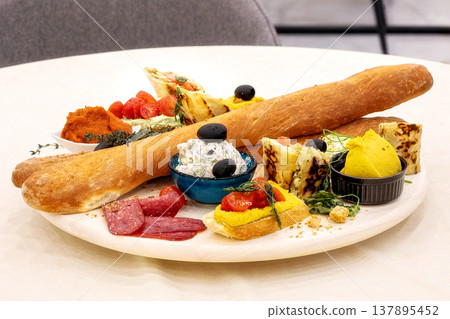 appetizer platter with baguette and various dips appetizer platter with baguette and various dips 137895452