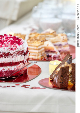 Dessert buffet with layered cakes Dessert buffet with layered cakes 137895455