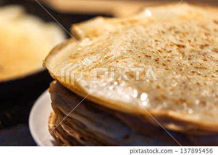 Stack of homemade crepes and frying pan Stack of homemade crepes and frying pan 137895456
