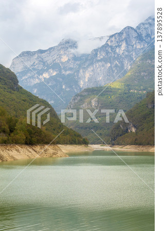 Mountain lake Lago di Vedana, Dolomites, Italy Mountain lake Lago di Vedana, Dolomites, Italy 137895528
