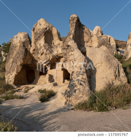 Ancient rock-cut dwellings in Cappadocia, Goreme, Turkey 137895767
