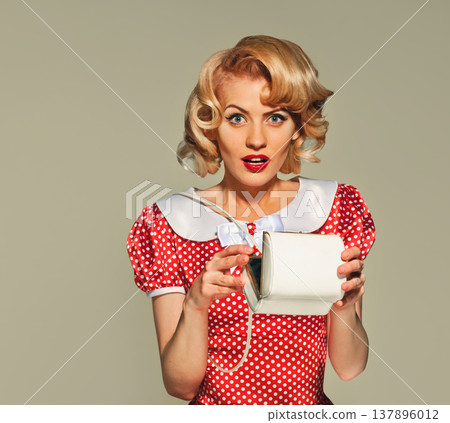 surprised pin-up girl with little bag 137896012