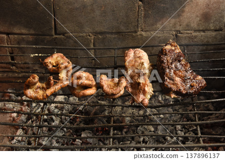 Cow bowels presented on a grill. Argentine Traditional cuisine. 137896137