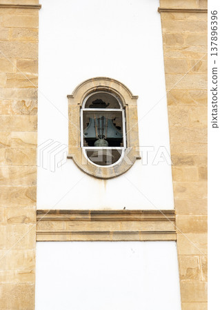 Church bell tower window with colonial stone frame 137896396